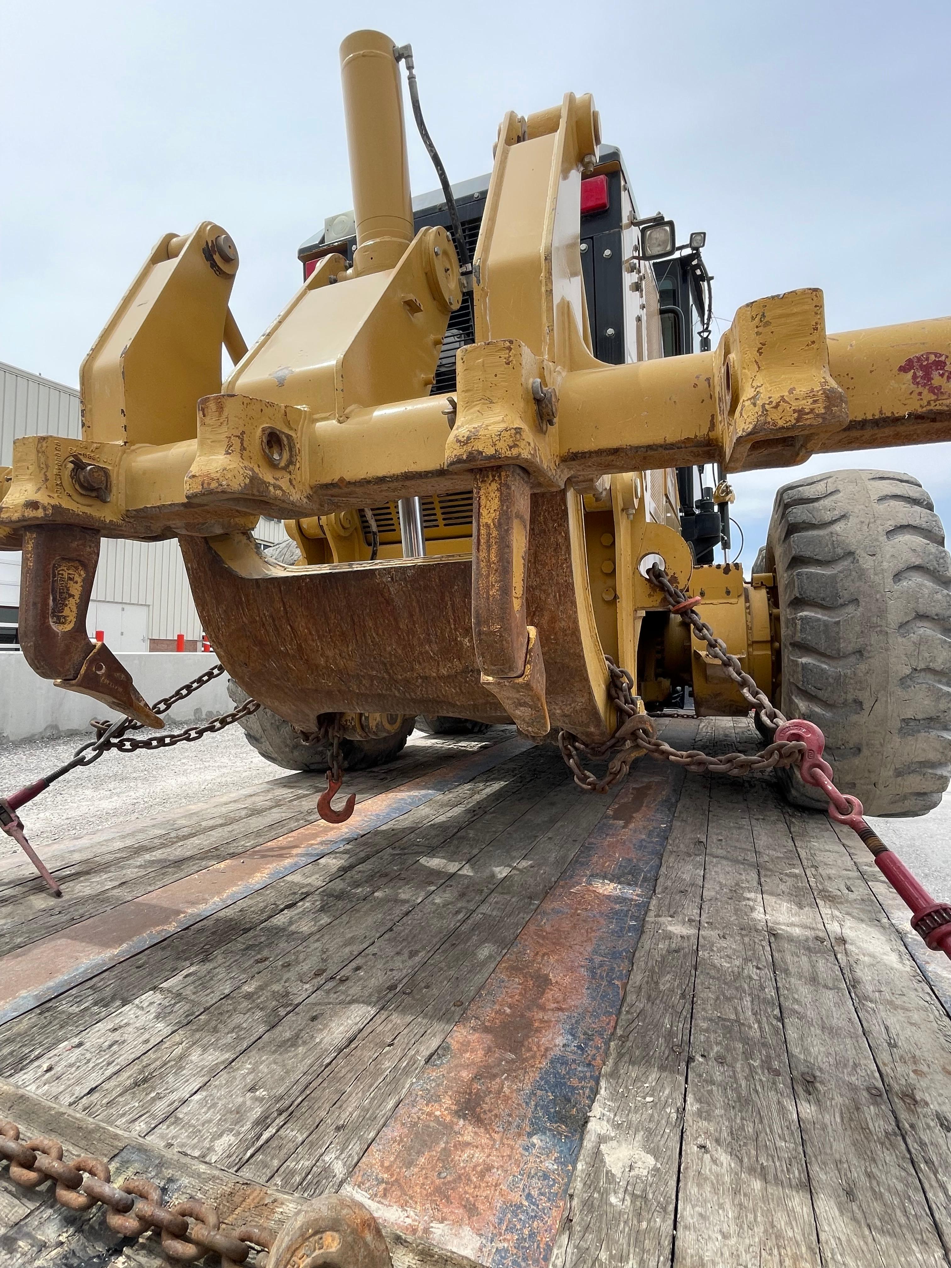 Cat machinery loaded on a Flatbed for transport ground heavy haul carriers move cargo
